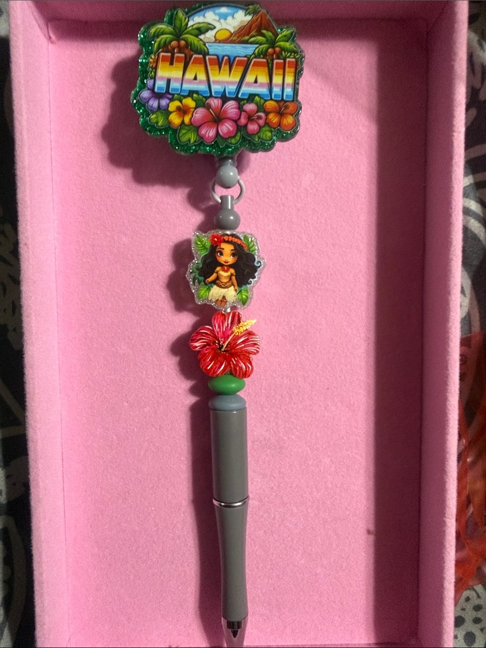 Hawaii beaded badge reel with retractable pen.